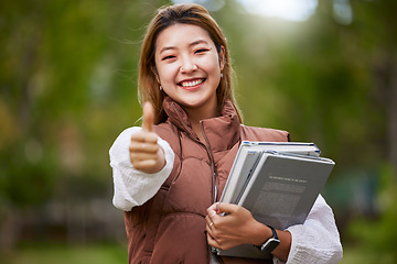 Image showing Student, thumbs up and portrait of woman with books for learning, education and outdoor on university campus with happiness or pride. Happy, face and girl in college with notebook or walking to class