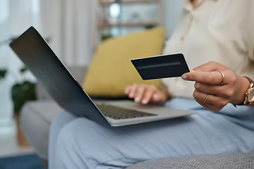 Image showing Laptop, credit card in hand and online shopping with woman at home, fintech and payment of bills with internet banking. Female person on sofa, e commerce and pc, store website discount and finance