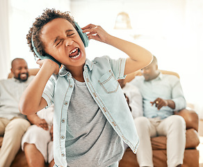 Image showing Loud singing, child headphones and home with a young boy listening to music and web audio. House, family and kid streaming radio and a song with crazy, comedy and humor in the lounge yelling