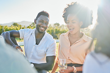 Image showing Happy, wine or couple of friends at a picnic relaxing or bonding on a summer holiday vacation in nature. Smile, black woman and funny black man enjoying quality time and drinking alcohol in a park