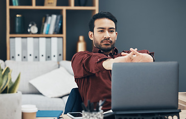 Image showing Laptop, working and man stretching fingers for carpal tunnel, muscle health or self care with work from home job. Business asian person or worker on computer and hands stretch to prepare for tasks