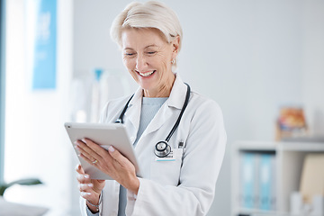 Image showing Healthcare, tablet and senior doctor smile in hospital for online consulting, telehealth and wellness app. Clinic, insurance and woman on digital tech for internet, medical research or patient data