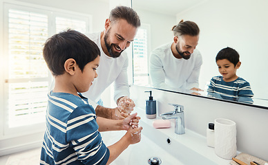 Image showing Cleaning, washing hands and father with boy in bathroom for hygiene, wellness and healthcare at home. Family, skincare and dad with child learning to wash with water, soap and disinfection by faucet