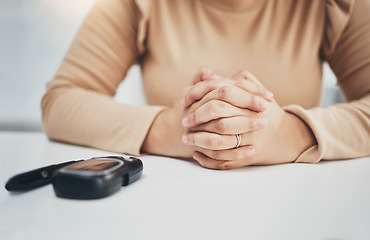 Image showing Hands, anxiety and diabetes with a woman waiting for the results of a test while sitting at a table. Healthcare, blood and equipment with a female diabetic testing her sugar or glucose level