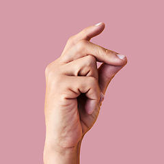 Image showing Click, finger snap and hand of man in studio for attention, ok and idea expression isolated on pink background. Sound, natural and yes with person and flick gesture for action, success and easy