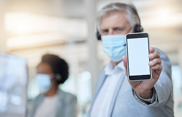 Image showing Phone, mockup and a man consultant in a call center for customer service or helpline support. Ecommerce, contact and website with a male telemarketing employee consulting while working in sales