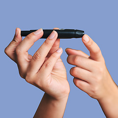 Image showing Hands, woman and blood sugar pen for diabetes in healthcare, medical testing or diabetic medicine. Fingers, insulin poke and check glucose for wellness, diet and glucometer results on blue background