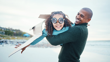 Image showing Beach, black family and daughter flying with her father while playing fantasy or pretend with imagination. Portrait, fun or plane with a man parent and girl child pilot bonding through play