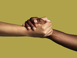 Image showing Diversity, handshake and grip for unity, support or deal in trust or agreement against studio background. Diverse people shaking hands in partnership for meeting, greeting or motivation on mockup