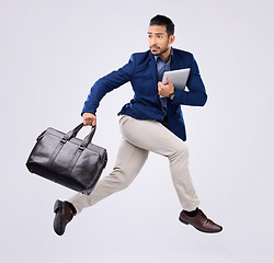 Image showing Hurry, work and an Asian man jumping for business isolated on a white background in a studio. Fast, serious and a corporate Japanese businessman running in the air while late to the workplace