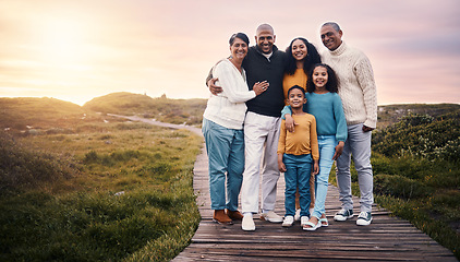 Image showing Happy family, portrait and people on vacation or holiday smile on a boardwalk and embrace together during sunset. Trip, getaway and grandparents with parents and children or kids bonding