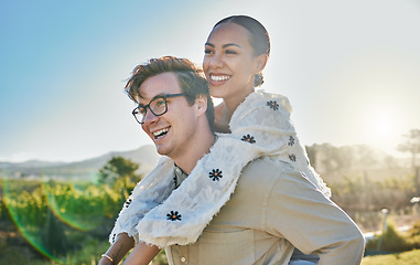 Image showing Couple, interracial and love with adventure outdoor, piggyback and smile while on holiday with summer and sun. Relationship, commitment and care with man and black woman, happy with peace and travel.