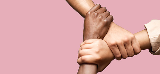 Image showing People, diversity and hands together in teamwork collaboration for trust against a pink studio background. Diverse group of friends holding hand in unity, solidarity or community agreement on mockup