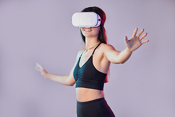 Image showing Virtual reality, fitness metaverse and woman in studio isolated on a purple background. 3d gamer, vr smile and happy female athlete with futuristic headset for gaming, esports and fantasy simulation.