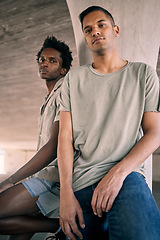 Image showing Portrait, fashion and diversity with friends in an urban city together for grunge style on a concrete background. Confident, streetwear and gen z with cool young men sitting in a town to relax