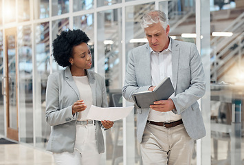 Image showing Business, office and employees walking, planning and discussion for new project, report and feedback. Coworkers, male manager and female leader with notebook, documents and conversation in workplace