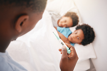 Image showing Black family, father and sick kids with thermometer for checking temperature, fever or illness at home in bed. Hand of African American dad taking children temp in bedroom for healthcare diagnosis