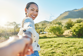 Image showing Woman, park portrait and pov for holding hands, romance and love on nature adventure in sunshine. Girl, summer and outdoor in countryside with smile, happy and bonding by trees, grass and mountain