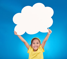 Image showing Speech bubble, thinking and portrait of child with idea, opinion and announcement on blue background studio. Talking, speaking mockup and excited, happy and young girl with smile, poster and banner