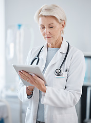 Image showing Healthcare, research and senior doctor with tablet for online consulting, telehealth and wellness app. Cardiology, hospital and woman on digital tech for internet, medical results and patient data