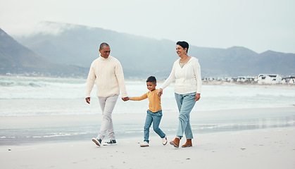 Image showing Grandfather, grandma and child walking on beach enjoying holiday, travel vacation and weekend together. Big family, nature and happy grandparents holding hands for bonding, quality time and relax