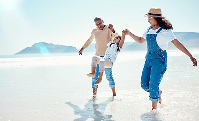 Image showing Family, beach and mother and father with girl playing for bonding, quality time and adventure together. Travel, happy and mom, dad and child enjoy summer holiday, vacation and relax on weekend by sea