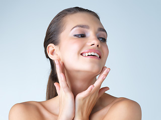 Image showing Smile, skincare and woman with beauty, thinking and confidence against a blue studio background. Female, cosmetics and lady with happiness, morning routine and grooming for clear, clean and soft skin