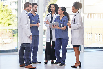 Image showing Doctors, diversity team and discussion in clinic for surgery planning, agenda report and medical schedule. Healthcare group, hospital employees and paperwork for expert help, results or collaboration