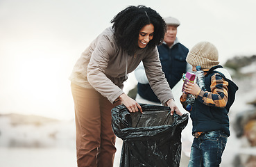 Image showing Beach cleaning, plastic and family with child volunteer for education, learning and community support. Happy people, mother and kid help with plastic waste, garbage or trash in climate change project