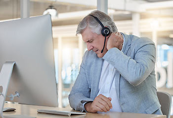 Image showing Call center, customer service and neck pain with a consultant man suffering from tension while working in the office. Crm, support and burnout with a senior male telemarketing working feeling stress