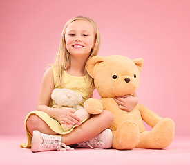 Image showing Teddy bears, girl and portrait with soft toys with happiness and love for playing in a studio. Isolated, pink background and a young female child feeling happy, joy and cheerful with stuffed friend