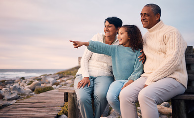 Image showing Love, beach and child on vacation with her grandparents sightseeing, bonding and having fun together. Travel, happy and elderly couple in retirement on a seaside holiday with a girl kid in Mexico.