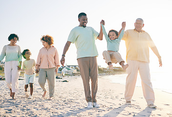 Image showing Family, grandparents and kids at beach, holding hands and jump with swing, happiness or bonding on holiday. Parents, children and senior people for love, vacation or summer sunshine in morning by sea