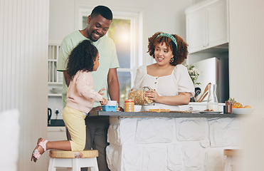 Image showing Family home, kitchen and child helping mom and dad with meal in the morning. Happy mother, father and young girl together with parent love, care and bonding with a kid and talking with a smile