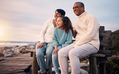 Image showing Happy, beach and girl on holiday with her grandparents sightseeing, bonding and having fun together. Travel, love and elderly couple in retirement on a seaside vacation with a girl child in Mexico.