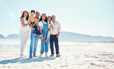 Image showing Portrait of grandparents, parents and children at beach for bonding, quality time and relax together by sea. Big family, travel and happy mom and dad with kids on summer holiday, vacation and weekend