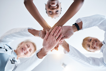 Image showing Doctor, group and stack hands in circle for teamwork portrait, happiness or support in hospital for healthcare goal. Doctors, clinic team and huddle for motivation, solidarity or diversity with women