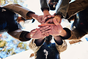 Image showing Goals, paintball team or hands in huddle for strategy, hope or soldier training on war battlefield. Mission, low angle or army people planning with support in partnership or military group solidarity