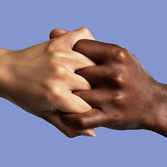 Image showing Hands, partnership and different with a collaboration of people in studio on a blue background for support. Fingers, linked and grip with friends joined together in unity, diversity or solidarity