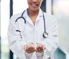 Image showing Ask, hands and open doctor in a hospital need help with donation, trust and support in a clinic with care. Medical, welcome and woman healthcare professional or worker with empty palm as trust