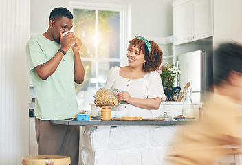 Image showing Love, coffee and couple in the kitchen for breakfast together in their modern family home. Happiness, smile and young man drinking a cappucino while bonding and cooking with his wife at their house.