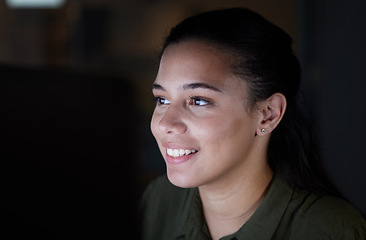 Image showing Happy, online and woman working at night in office, excited for solution or creative idea on dark background. Startup, smile and female leader with business goal, excited and cheerful reading email