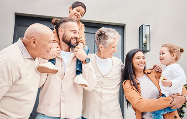 Image showing Family, love with children, parents and grandparents bonding outside of their home together during a visit. Kids, garden or summer with a group of happy people standing on real estate outdoor