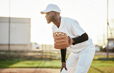 Image showing Athlete, baseball player or hand glove on field, sports or arena ground in game, match or competition. Black person, softball or mitt in fitness, exercise or training workout in pitcher stadium flare