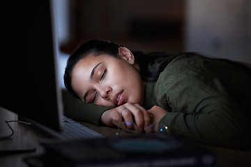 Image showing Tired, night and a business woman sleeping at her desk while working overtime in her office. Burnout, deadline and exhausted with a female employee asleep in the workplace during the late shift