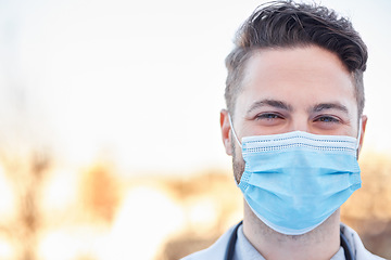 Image showing Covid face mask, doctor and man portrait outdoor with space for medical and health mockup. A happy healthcare worker with ppe for corona virus safety, policy and compliance for wellness and help