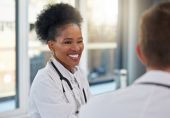 Image showing Doctor, happy black woman and meeting healthcare team for hospital management, medicine and discussion. Female surgeon, smile and talking to employees in collaboration, surgery and medical planning