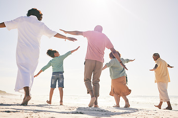 Image showing Family on beach, freedom and generations on vacation with fun and grandparents, parents and kids. Travel, people outdoor and carefree, excited running and playful, happiness on adventure back view