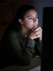 Image showing Serious, night and woman on computer in office, working late on online project, proposal and planning. Concentration, thinking and female reading screen for internet, network or website research