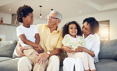 Image showing Grandparents, grandchildren and children with elderly people in a home bonding, playing and enjoying quality time together. Kids, grandmother and grandfather relax with grandkids for holiday